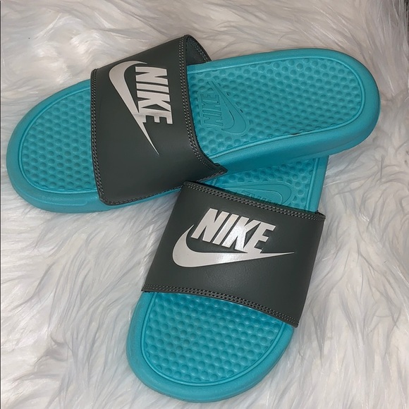 blue and grey nike slides